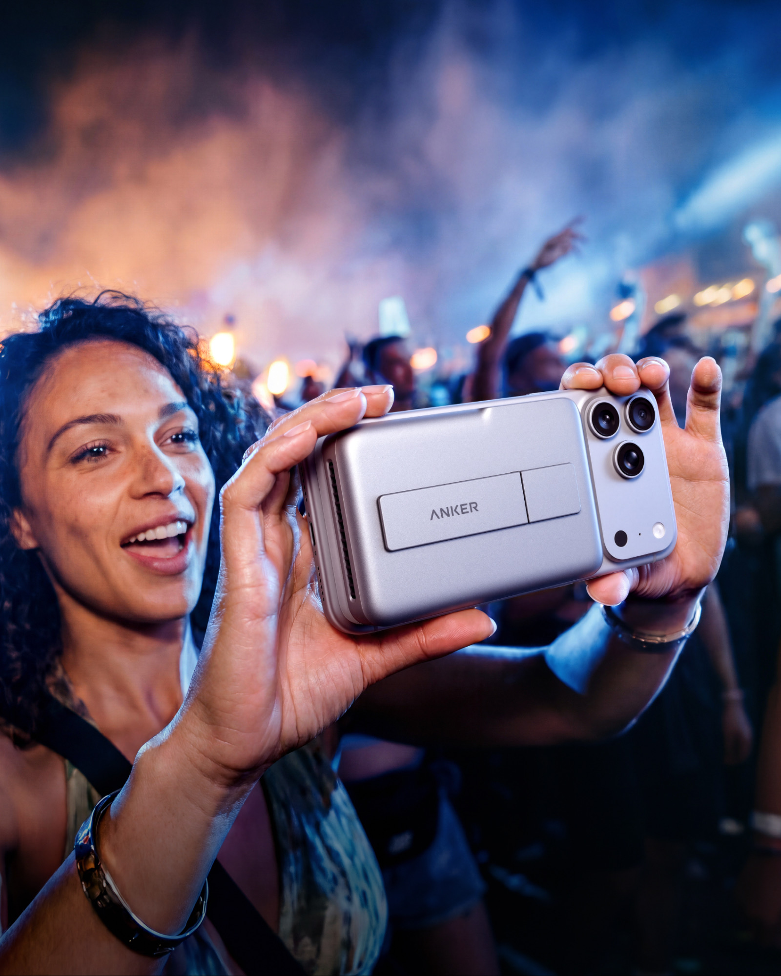 Anker MagGo Power Bank 2 Pro attached to a smartphone at a product event.