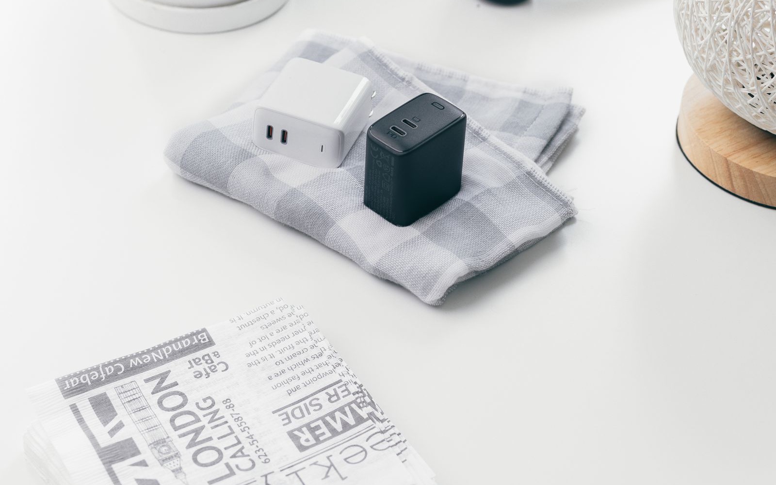 Two multiport chargers photographed on a table.