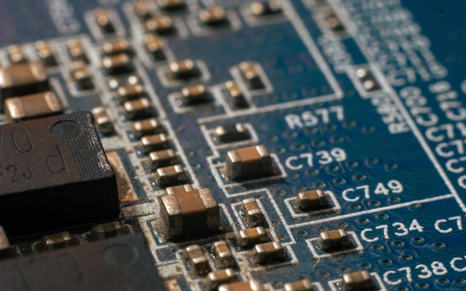 Macro view of components and soldered parts on a circuit board, used as an editorial illustration for RoHS evidence checks.